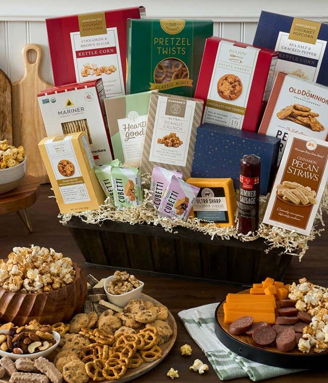 Gourmet snack basket with cheese, popcorn, sausage and more