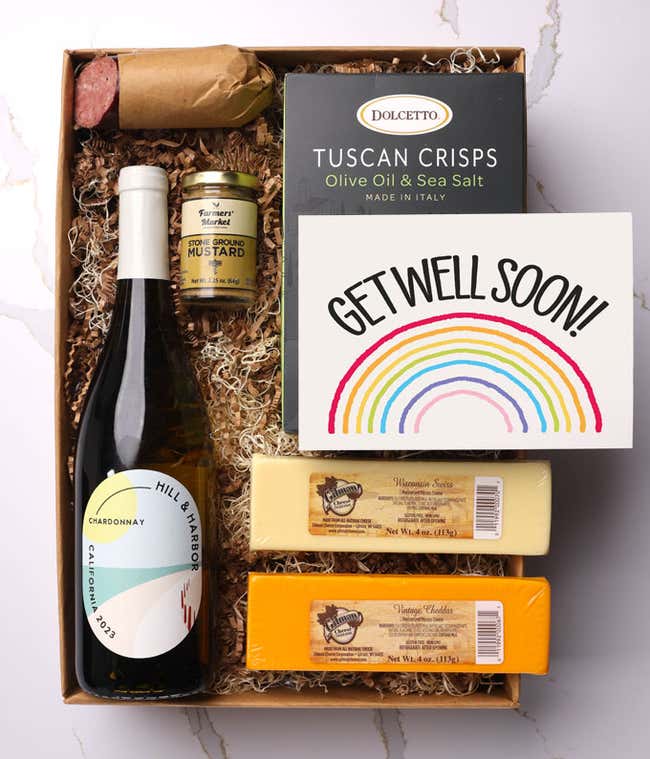 A gift box with a bottle of California Pinot Noir, two types of cheese, crackers, stone-ground mustard, a summer sausage and a Get Well Soon message card.