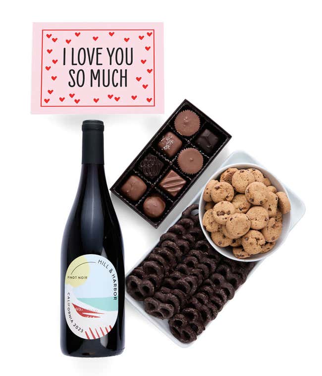 a gift box full of decadent treats with an I Love You message card.  Contents include: a bottle of California Pinot Noir, a bag of milk chocolate pretzel, a box of mini chocolate chip cookies, and a 4-ounce box of assorted chocolates.