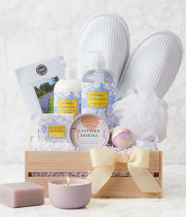 Lavender spa gift crate with waffle slippers, loofah, lavender &amp; thyme candle, lavender bath bomb, lavender chamomile hand soap, lotion, bar soap, and scented sachet