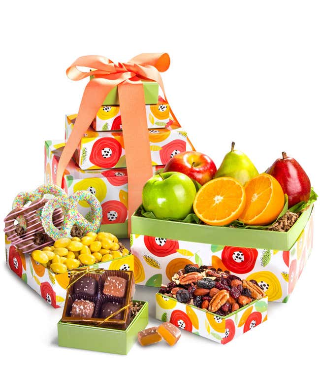 Springtime Gift Tower: Includes Green D'Anjou Pear, Red D'Anjou Pear, Navel Orange, Braeburn Apple, Granny Smith Apple, Gourmet Brownies, Cherry Berry Trail Mix, Lemon Cr&egrave;me Almonds, and Milk &amp; Dark Chocolate Sea Salt Caramels.