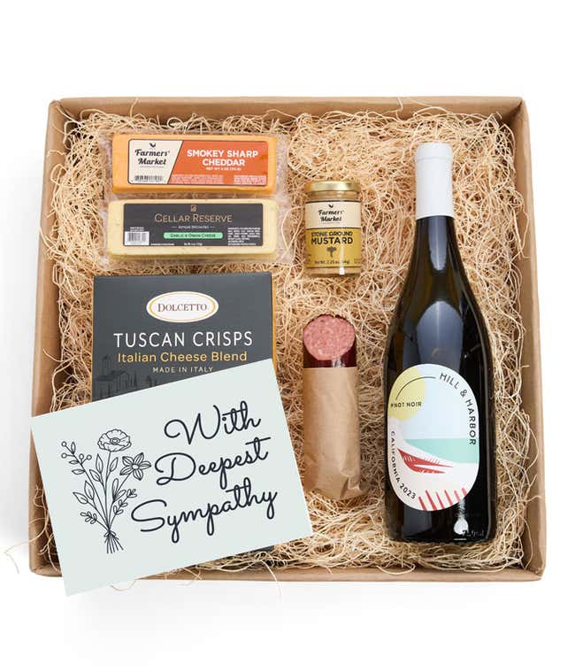 A gift box with a bottle of California Pinot Noir, two types of cheese, crackers, stone-ground mustard, a summer sausage and a With Sympathy message card.