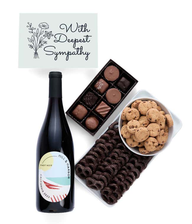 a gift box full of decadent treats with a Sympathy message card.  Contents include: a bottle of California Pinot Noir, a bag of milk chocolate pretzel, a box of mini chocolate chip cookies, and a 4-ounce box of assorted chocolates.