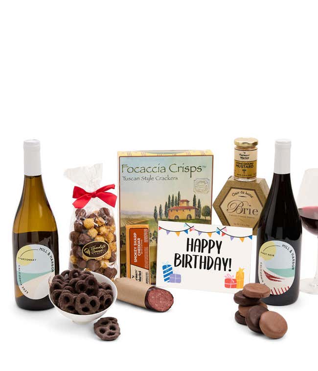 A gift set featuring two bottles of Hill &amp; Harbor wine - white and red, focaccia crisps, two cheeses, mustard, summer sausage, caramel popcorn, chocolate pretzels, six chocolate-covered Oreos and a Birthday card to complete the gourmet experience.
