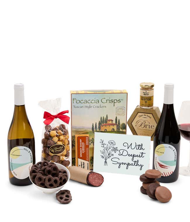 A gift set featuring two bottles of Hill &amp; Harbor wine - white and red, focaccia crisps, two cheeses, mustard, summer sausage, caramel popcorn, chocolate pretzels, six chocolate-covered Oreos and a Sympathy card to show your support.