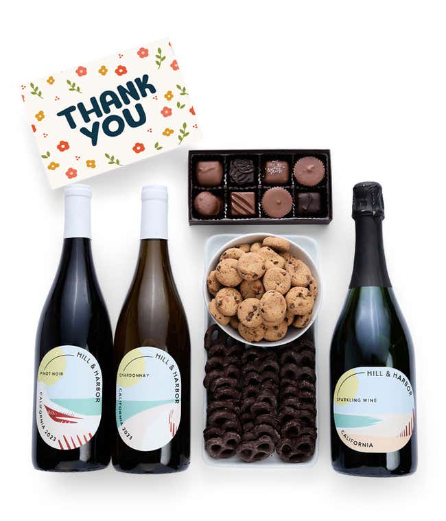 A Thank You gift set with three bottles of Hill &amp; Harbor wine (Pinot Noir, Chardonnay, and sparkling wine), a box of assorted chocolates, chocolate-covered pretzels, a box of mini chocolate chip cookies, and a Thank You greeting card.