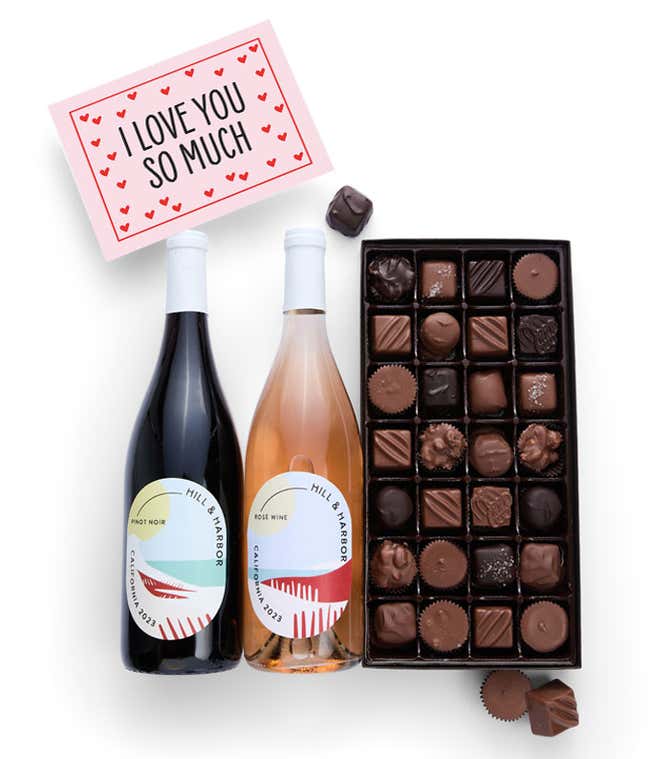 A gift box containing two bottles of California Wine - Pinot Noir &amp; Ros&eacute; wine, a 1 lb box of 28 assorted gourmet chocolates in a grid, and an I Love You! message card.   A decadent way to share your love.